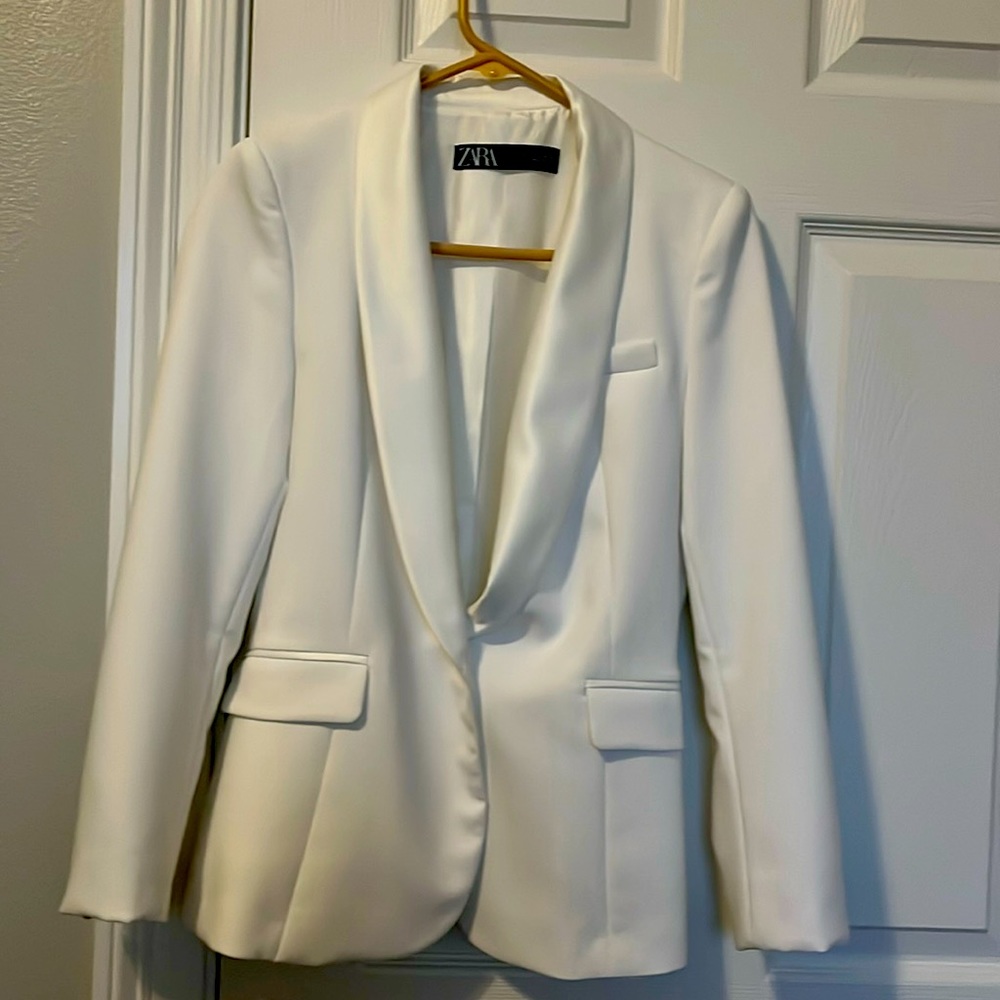 White woman’s blazer with white satin trim , collar and covered buttons